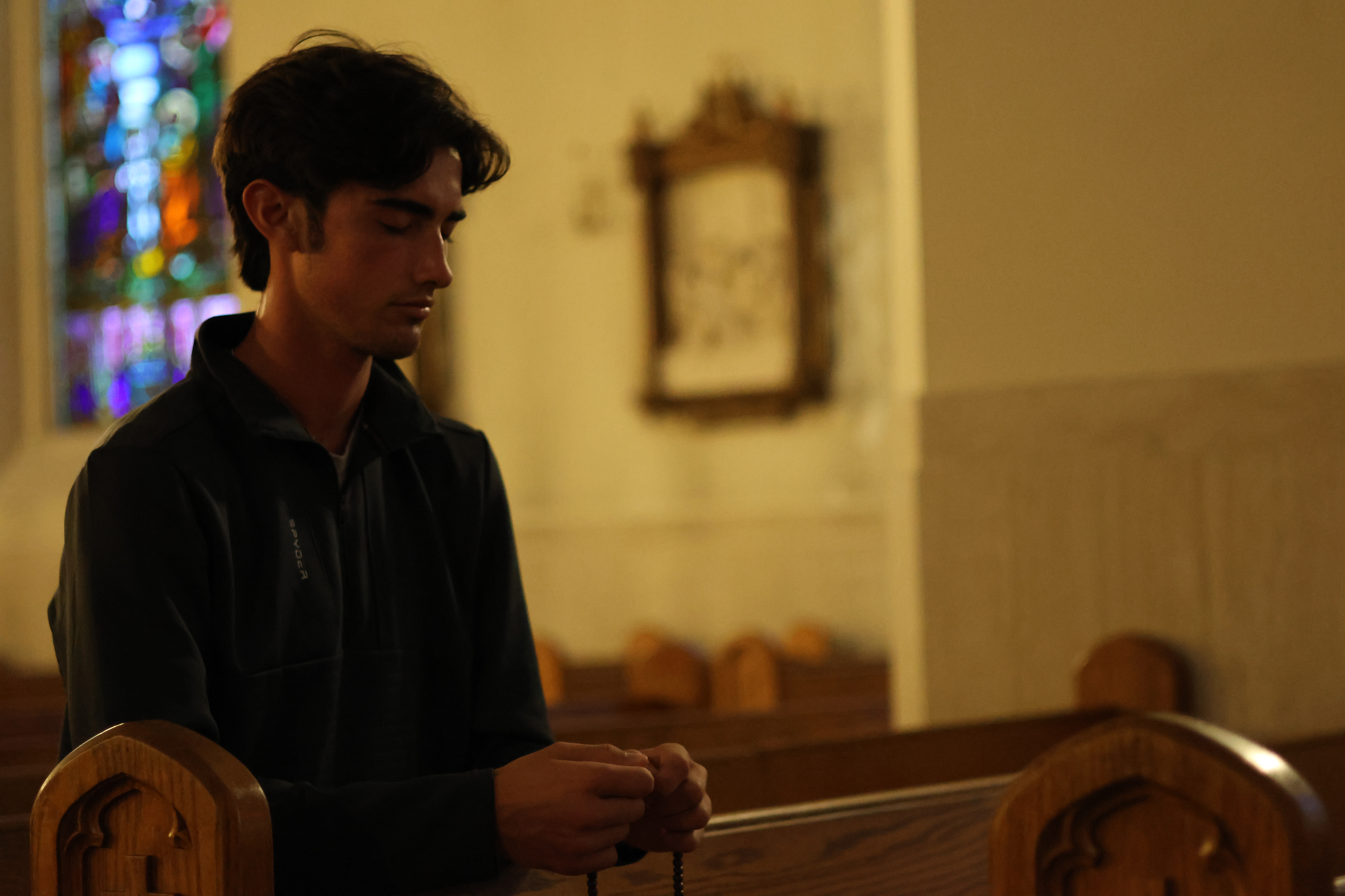A catholic gentleman praying the rosary